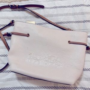 Coach purse, limited use, still has wrapping on zippers
